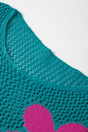 Openwork floral intarsia sweater in teal with pink floral detail, acrylic knit.