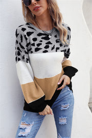 Leopard Patchwork Balloon Sleeve Knit sweater in grey, white, tan, and black acrylic.