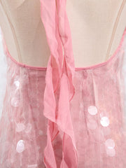 Pink iridescent sequin halter mini dress with ruffled trim and mesh overlay.