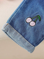 Baby denim set with embroidered cherries and cuffed hem.