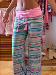 Relaxed fit striped joggers with pink drawstring waist and wide legs.