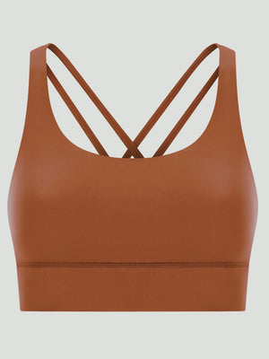 Caramel sports bra with crisscross back straps and a scoop neckline.