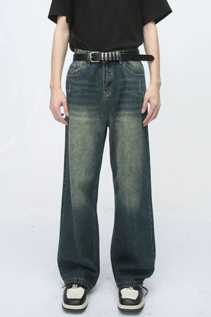 Relaxed fit dark wash denim jeans with pockets and a faded look.
