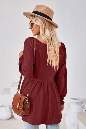 Burgundy textured babydoll blouse with smocked cuffs and square neckline.