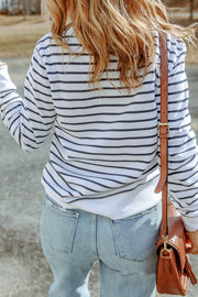 Nautical stripe crewneck sweatshirt in white with navy stripes, crewneck, long sleeves, casual style.