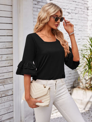Black blouse with square neckline and ruffled bell sleeves