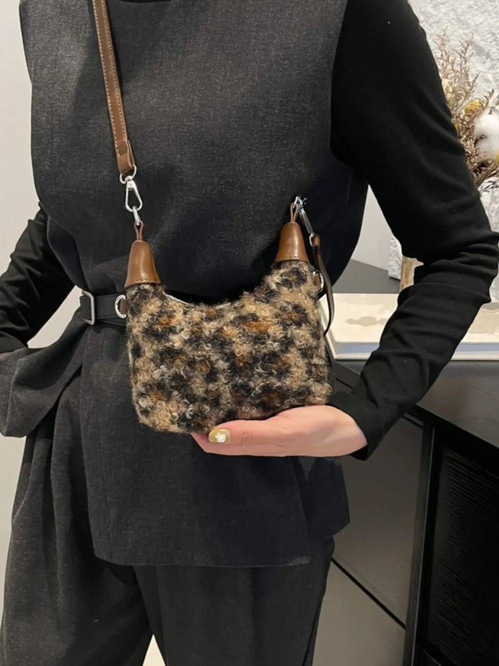 Shearling check mini shoulder bag with brown leather trim and strap.
