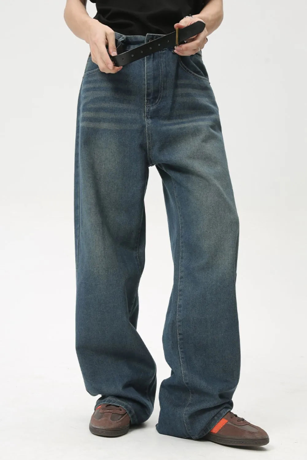 Baggy denim jeans in medium wash with subtle fading and a relaxed fit.