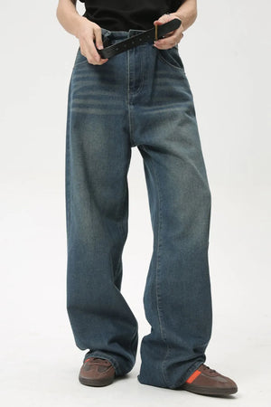 Baggy denim jeans in medium wash with subtle fading and a relaxed fit.