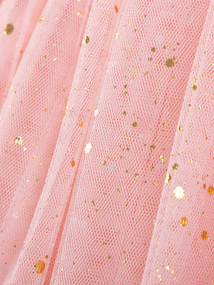 Pink tulle baby dress with gold glitter dots, close-up detail.
