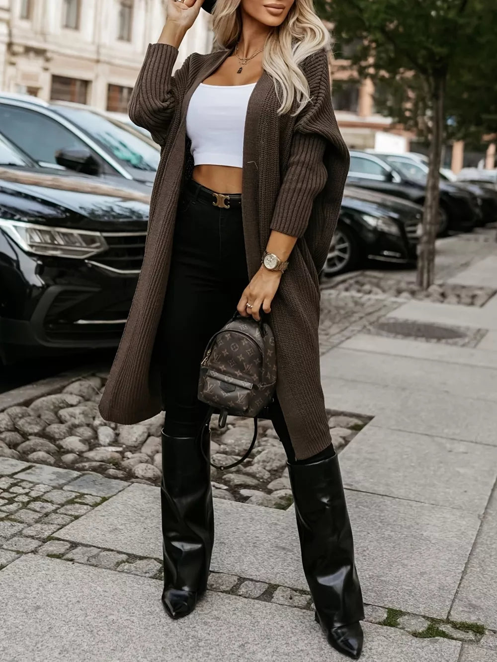Brown ribbed texture longline knit cardigan with open front and long sleeves.
