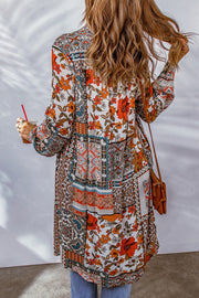 Patchwork print duster shirt jacket with button front and long sleeves.