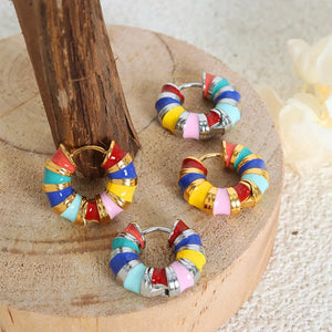 Rainbow enamel segmented hoop earrings with gold accents and silver posts.