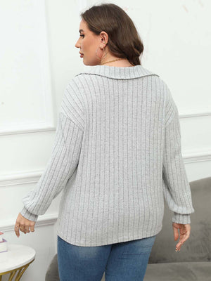 Relaxed ribbed polo top in gray with a collared neckline and long sleeves.