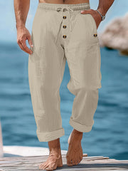 Khaki relaxed fit drawstring sweatpants with button fly and cuffed hems.