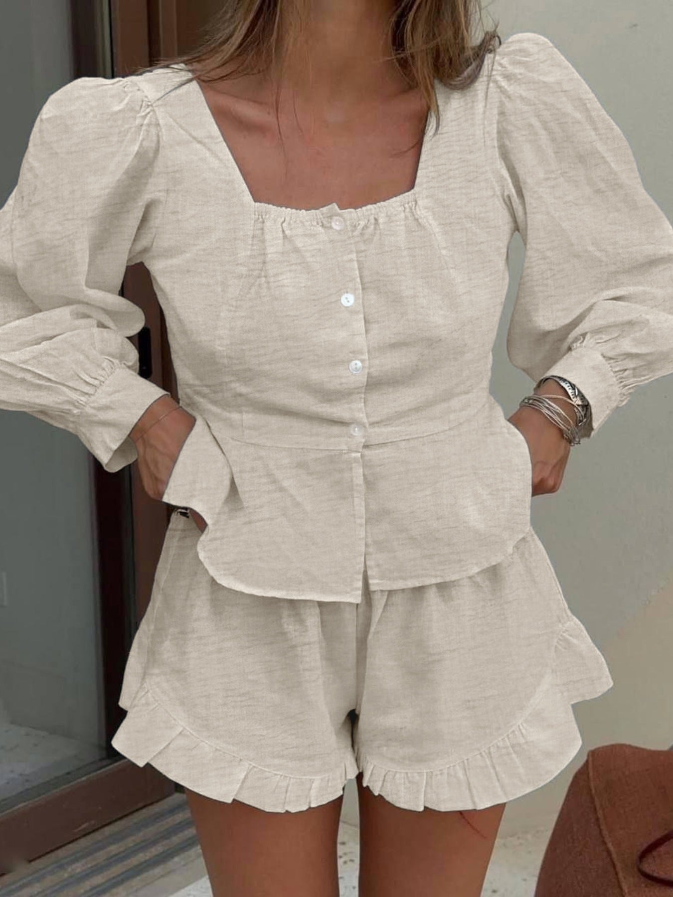 Beige button front lantern sleeve top with square neckline and ruffled shorts set