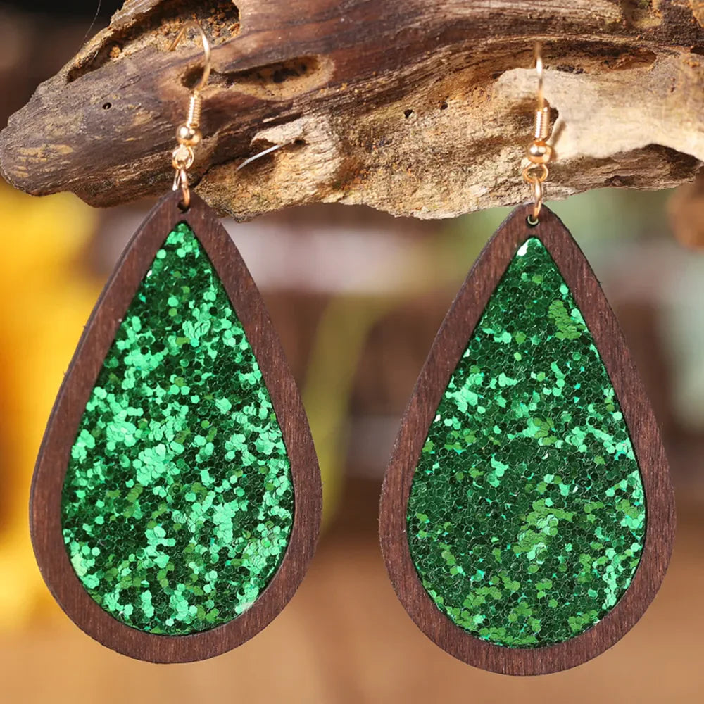 Green glitter teardrop earrings with wood frame and gold hooks