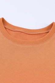 Orange crewneck sweatshirt with ribbed neckline and cuffs