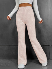 Sculpted ribbed flare trousers in blush pink polyester with a high waist and bootcut leg.
