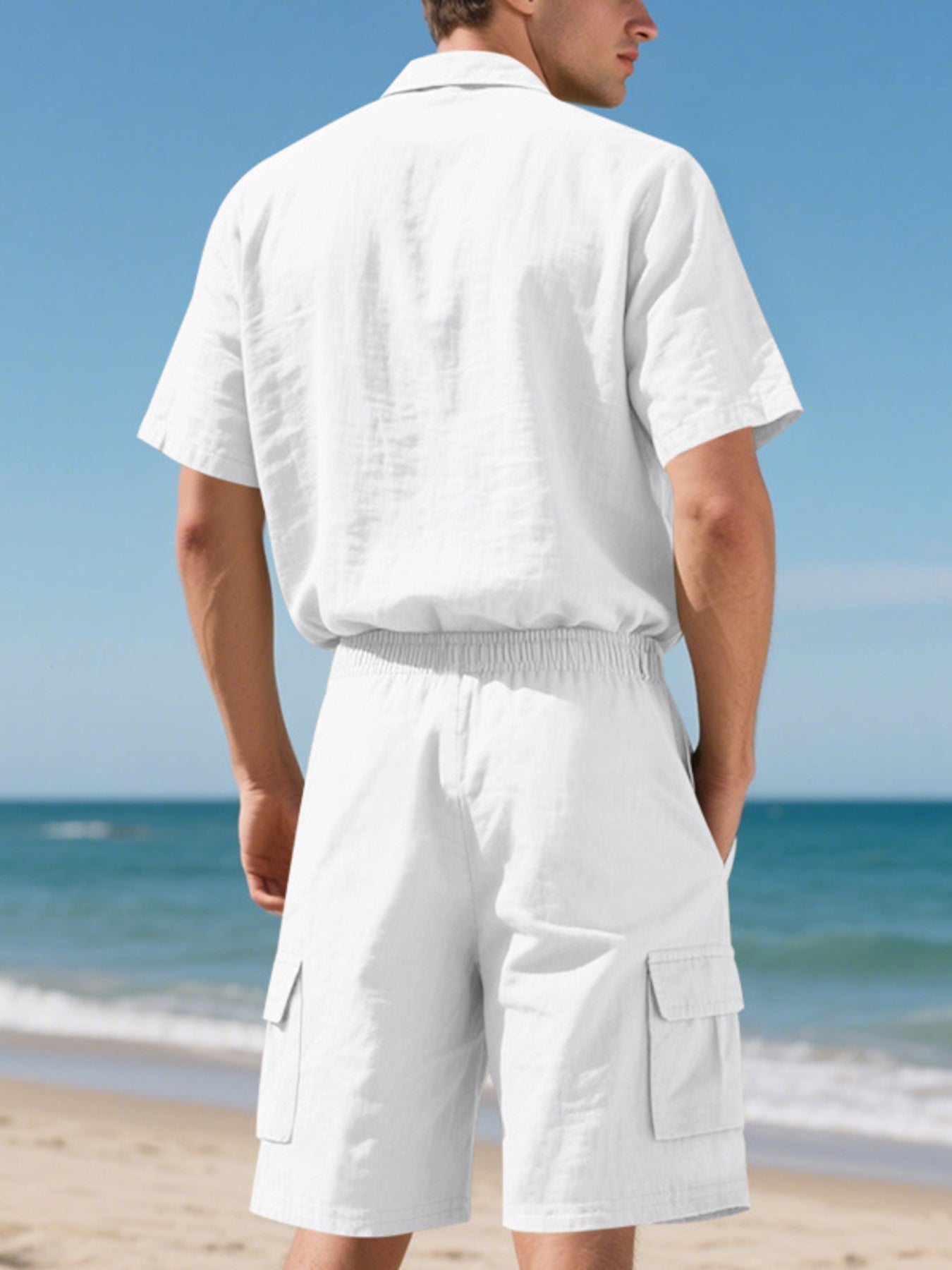 White relaxed-fit button-up shirt and cargo shorts set with drawstring waist.