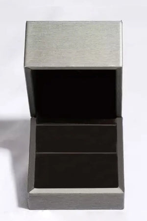 Silver moissanite ring box with open lid and dark interior.