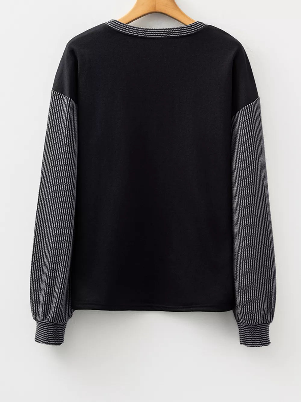 80% polyester, 20% cotton Care instructions: Machine wash cold t-shirt in Black with relaxed silhouette