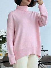 Relaxed fit ribbed turtleneck sweater in blush pink acrylic with a casual, basic style.