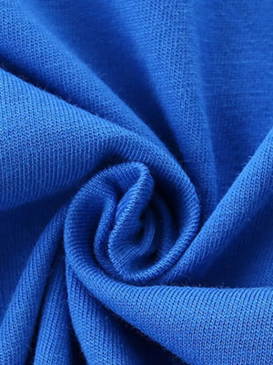Blue t-shirt fabric detail, showing ribbed texture and soft cotton knit.