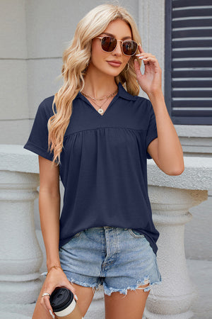 Dark Blue polo top with gathered yoke and short sleeves.