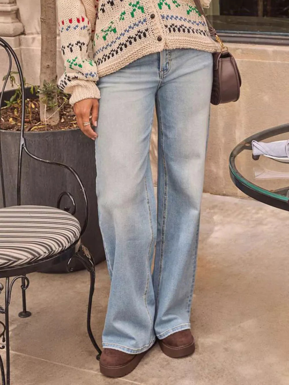 Light blue denim high-waisted wide-leg jeans with a buttoned front.