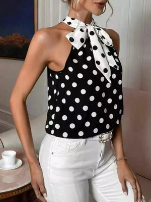Black polka dot cami with a white polka dot bow tie neck.