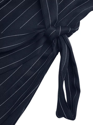 Navy striped tie-waist A-line dress with a knot detail.
