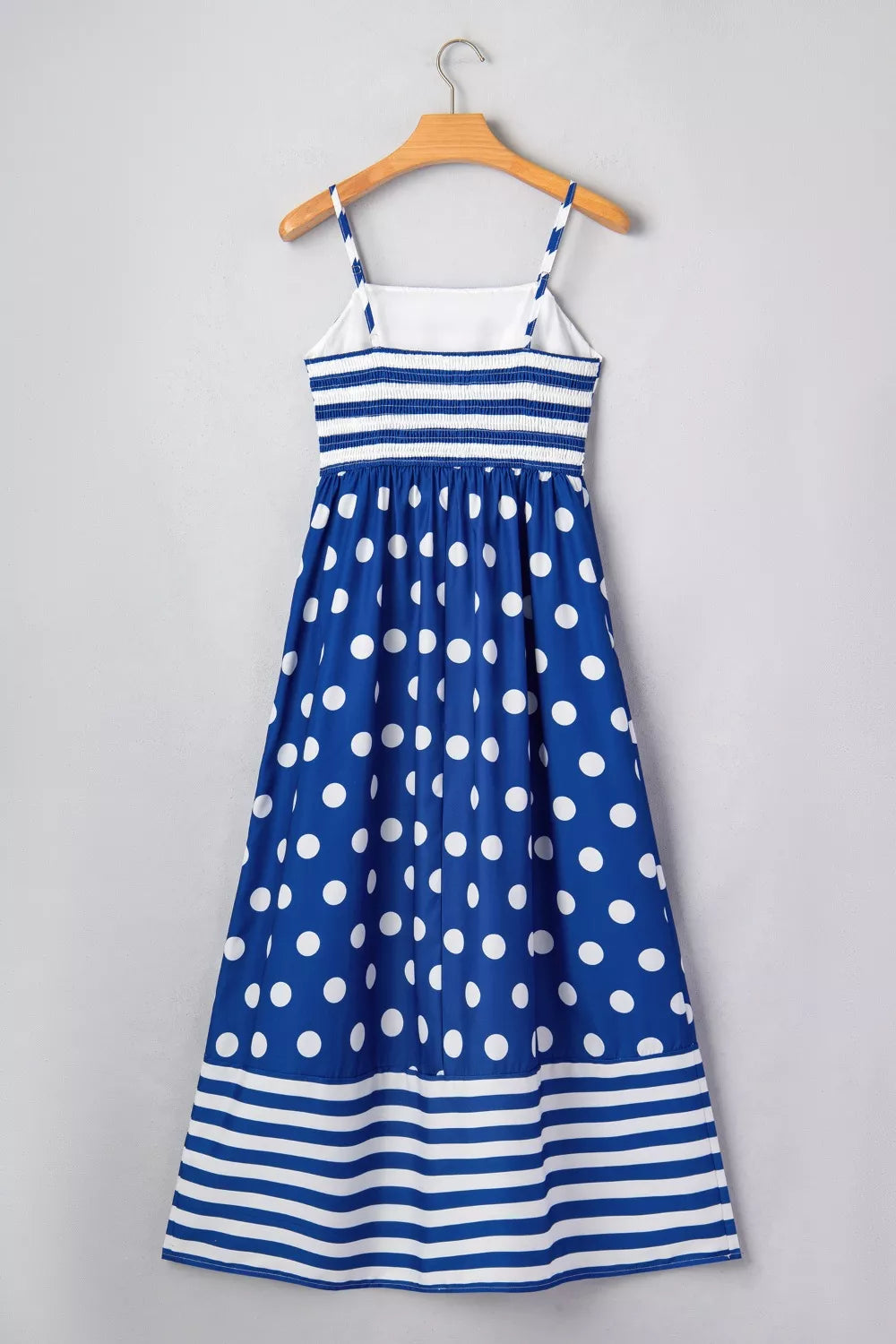 Blue polka dot maxi swim dress with white stripes and spaghetti straps.