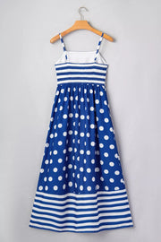 Blue polka dot maxi swim dress with white stripes and spaghetti straps.
