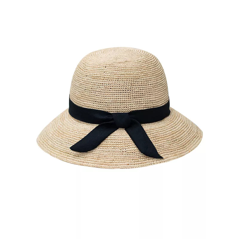 Chic wheat straw sun hat with black bow detail