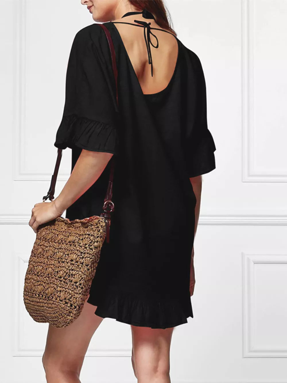 Black ruffled V-neck beach cover-up with tie back and ruffled hem.