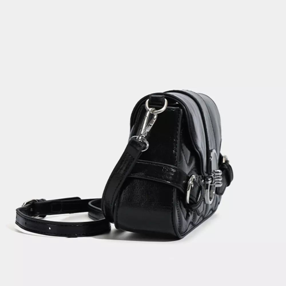 Black heart-quilted crossbody bag with buckle accents and a silver chain strap.