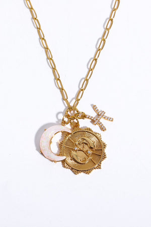 Gold zodiac pendant necklace with moon and Pisces charm