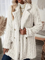 White faux shearling double-breasted coat with cable knit texture and button closure.