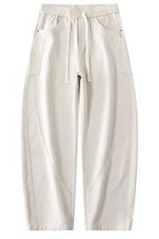 Off white relaxed fit drawstring waist men's cotton jeans with casual styling.