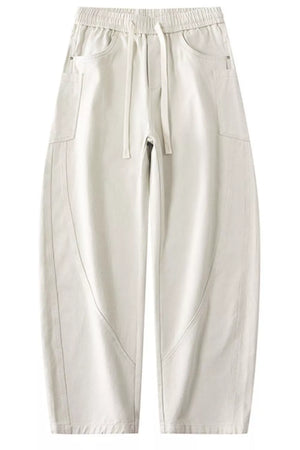 Off white relaxed fit drawstring waist men's cotton jeans with casual styling.