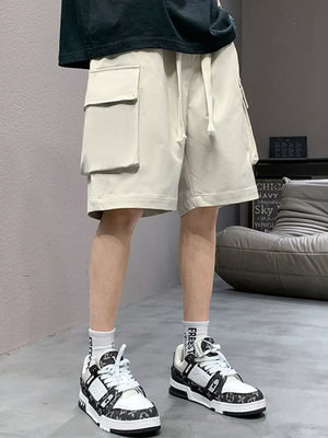 Apricot relaxed fit cargo shorts with drawstring and dual flap pockets.