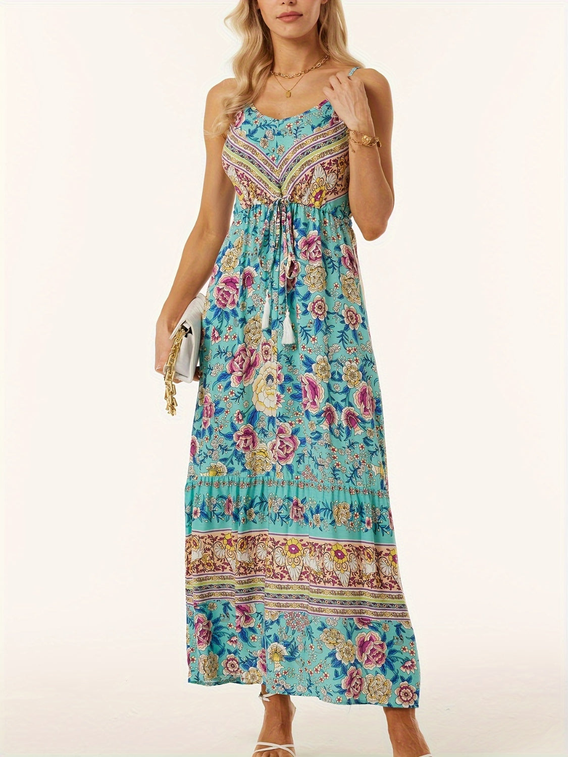 Turquoise floral print maxi dress with adjustable waist and tassel tie.
