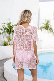 Textured knit beach cover-up with side slits in blush pink and white, short sleeves, V-neck.