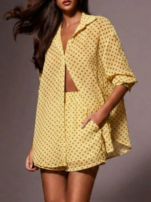 Yellow polka dot sheer two-piece set with collared button-up shirt and shorts.