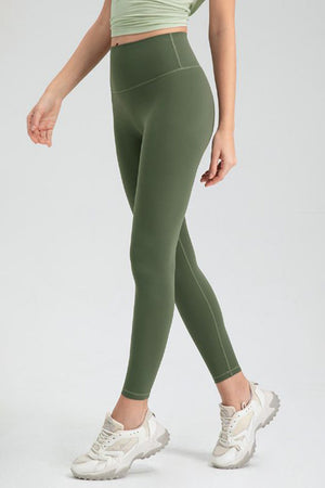 Green high rise leggings with a seamless waistband and athletic fit.