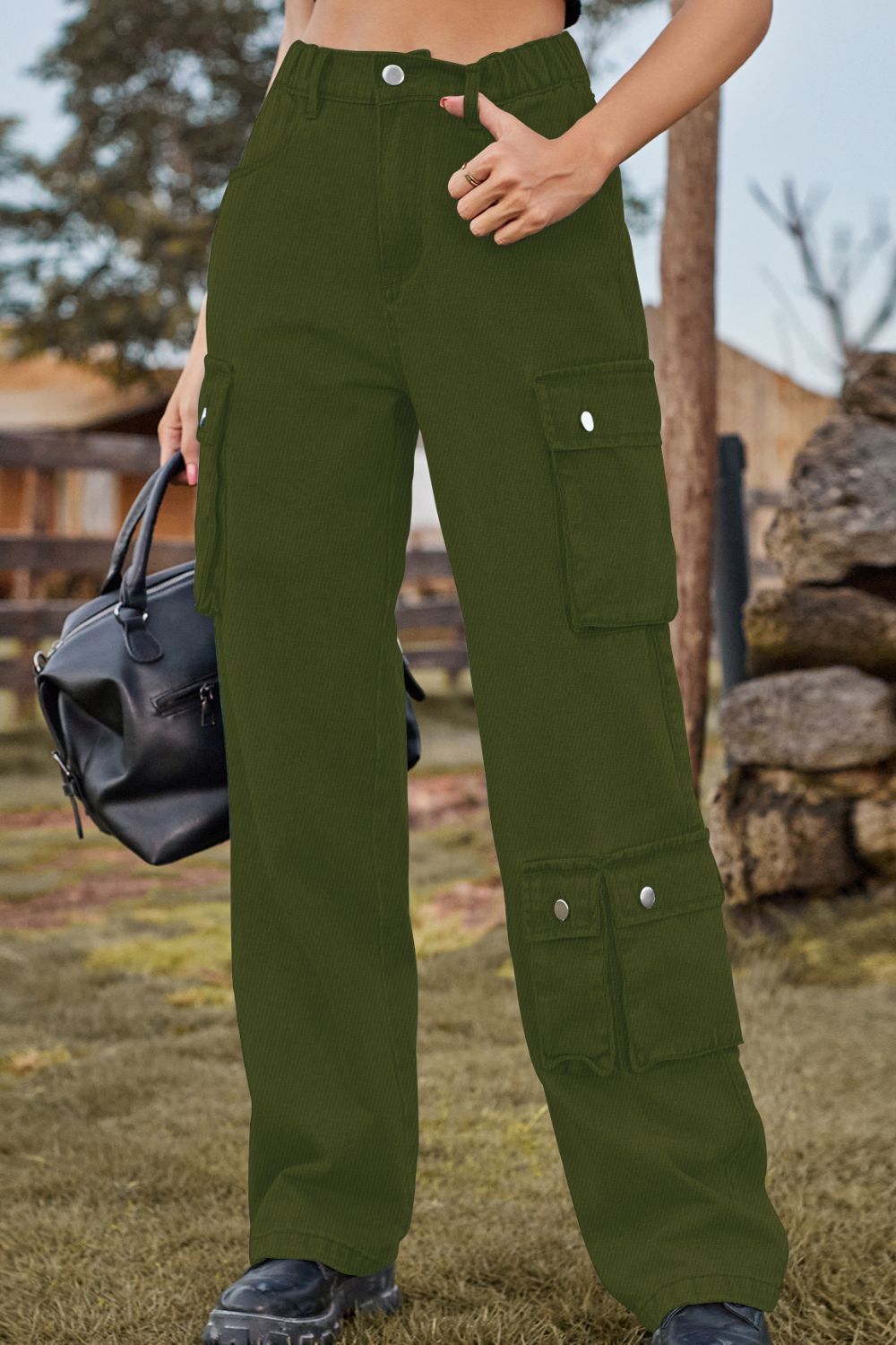 Army green denim cargo pants with relaxed wide leg and multiple utility pockets.