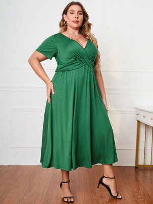 Emerald twist-front midi dress in dark green with short sleeves and a V-neck.