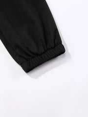 Black sweatpants with elasticated cuffs and subtle butterfly embellishment detail.