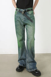 Acid wash flare denim jeans in medium with green ombre effect and a black belt.